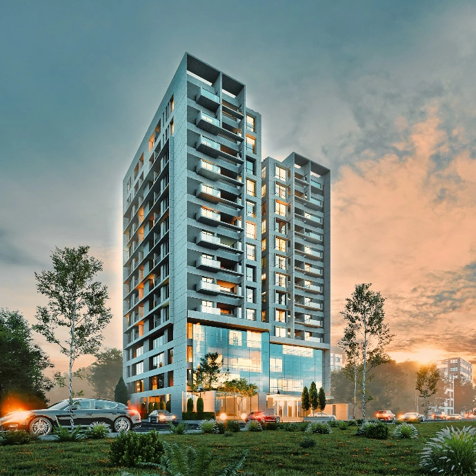 Modern apartment building at sunset with trees and car.